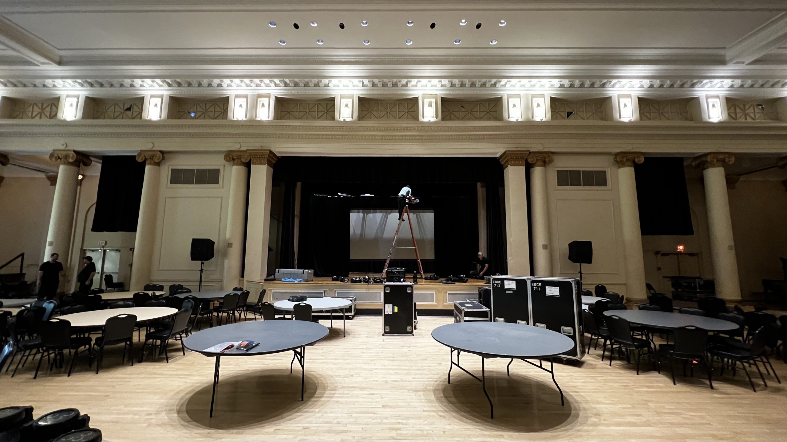 Large space av set up with tables and ladder