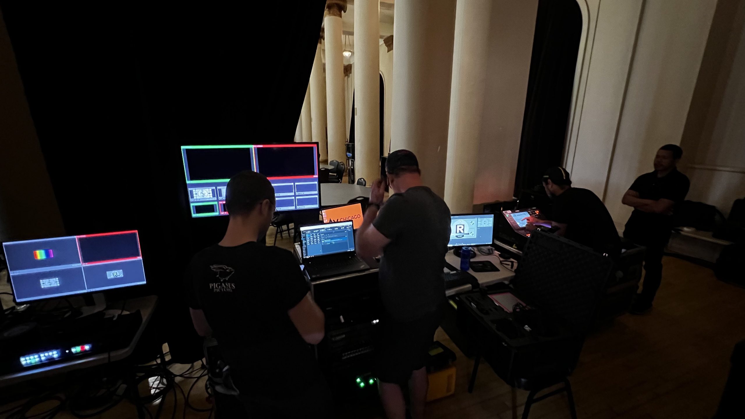 AV Chicago crew working on monitors behind the scenes
